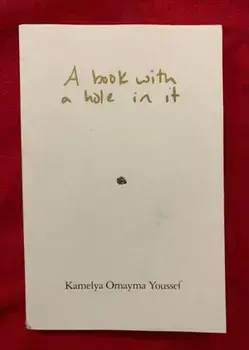 A book with a hole in it, Paperback/Kamela Omayama Youssef