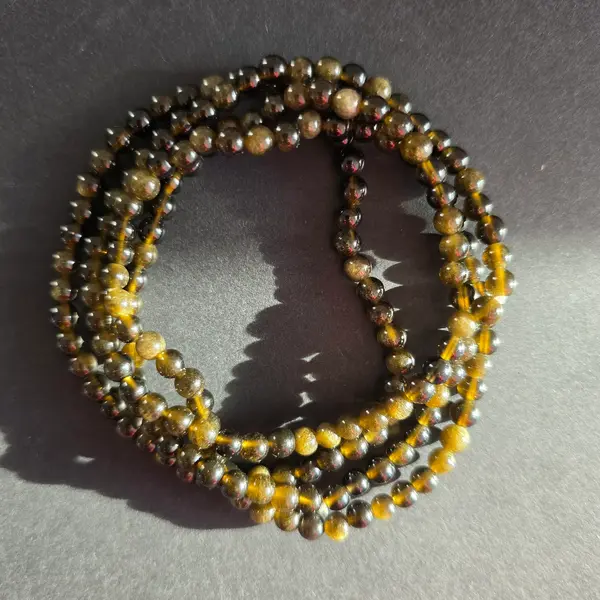 Bratara obsidian auriu 4-5 mm