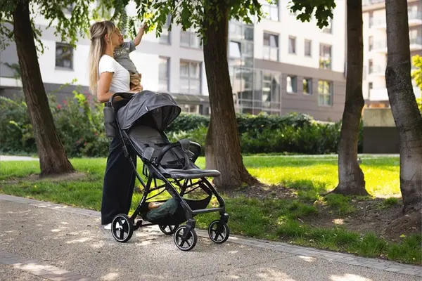 Carucior pentru copii, Kidnort Fjallrav Black, cu pliere compacta, suspensie integrala, spatar si viziera reglabile, pana la 22 kg, accesorii incluse, suport pentru pahar, husa transport