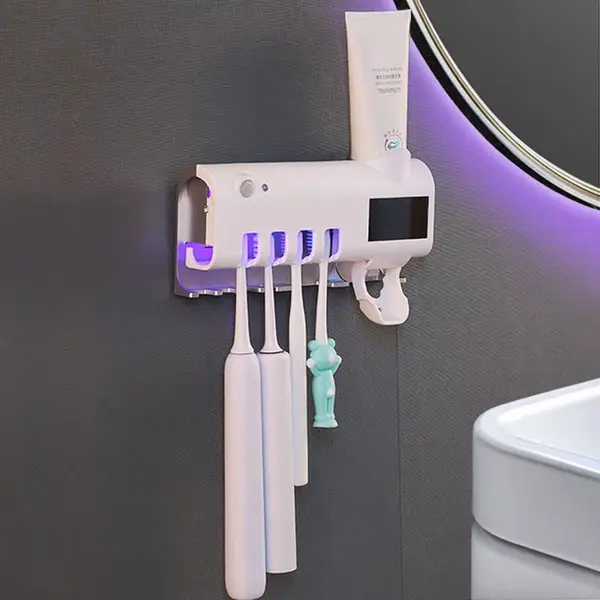 Dozator pentru pasta de dinti cu alimentare solara si sterilizator UV pentru periute