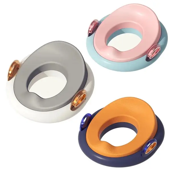 Reductor WC pentru copii Little Mom White, detasabil, design ergonomic cu manere si colac confortabil din PU, echipat cu sistem de fixare, pentru copii cu varsta pana la 7 ani, protectie impotriva stropilor