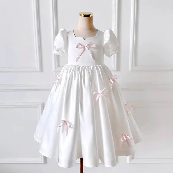 Rochie albă eleganta pentru fete, cu fundite roz si maneca bufanta din tafta - Cassandra